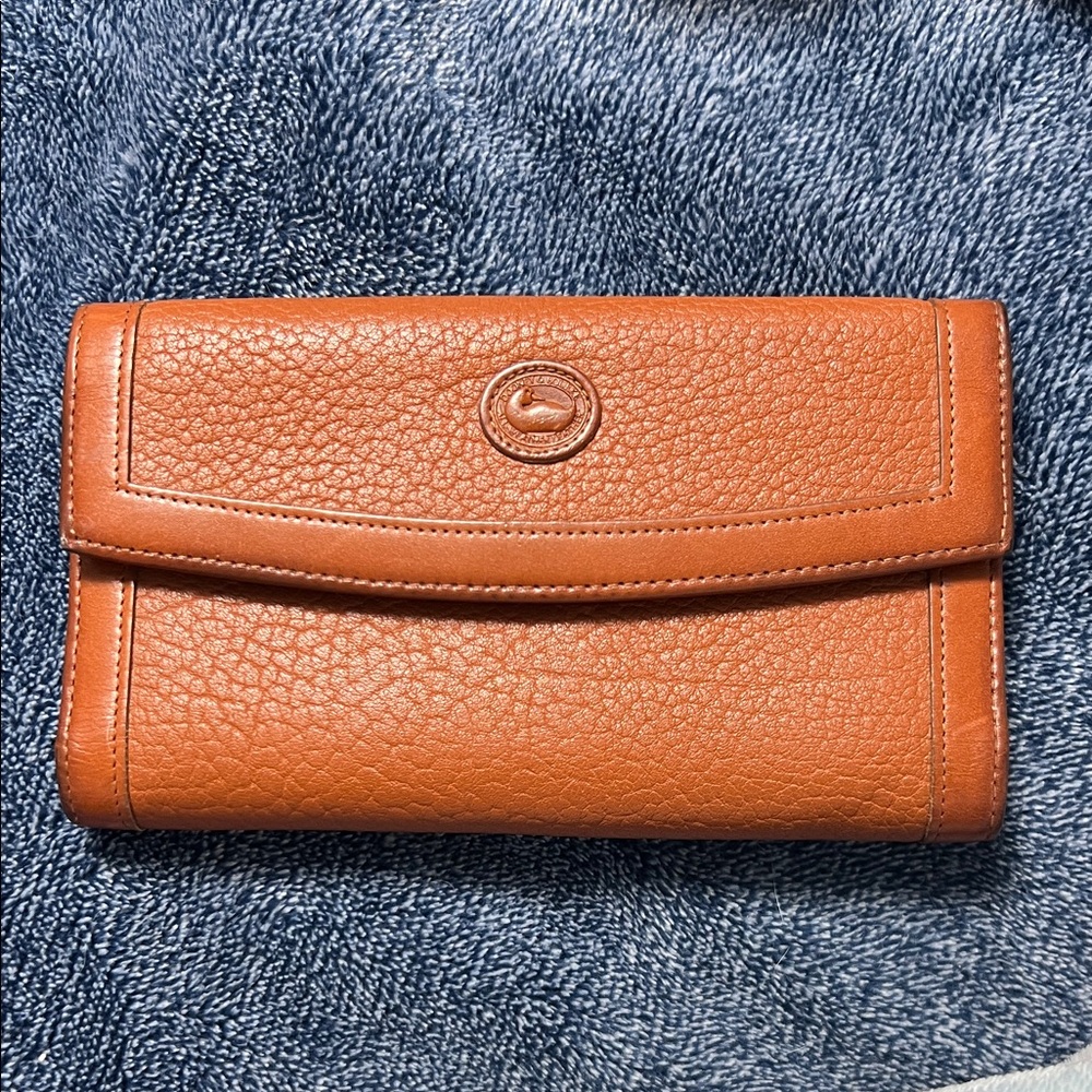 Dooney & Bourke Pebbled Leather Wallet in a dark caramel color.